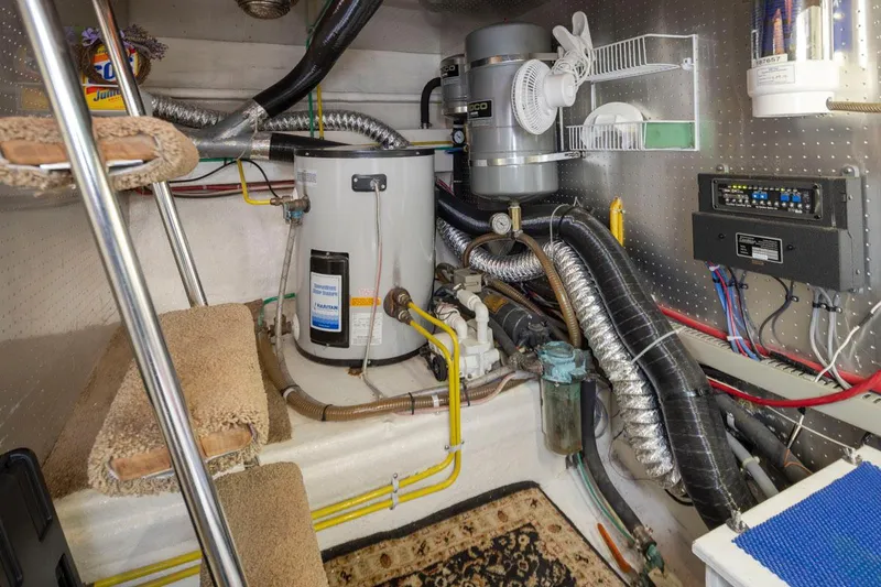 Slide: The Image of Engine room of 1989 Ocean Alexander 50 Sedan with equipment and wiring. - 39