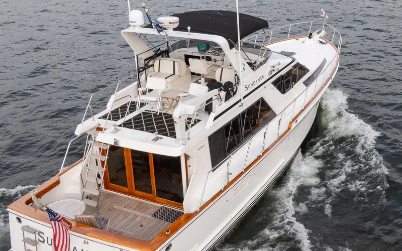 Slide: The Image of 1989 Ocean Alexander 50 Sedan yacht cruising on open water, rear view. - 4