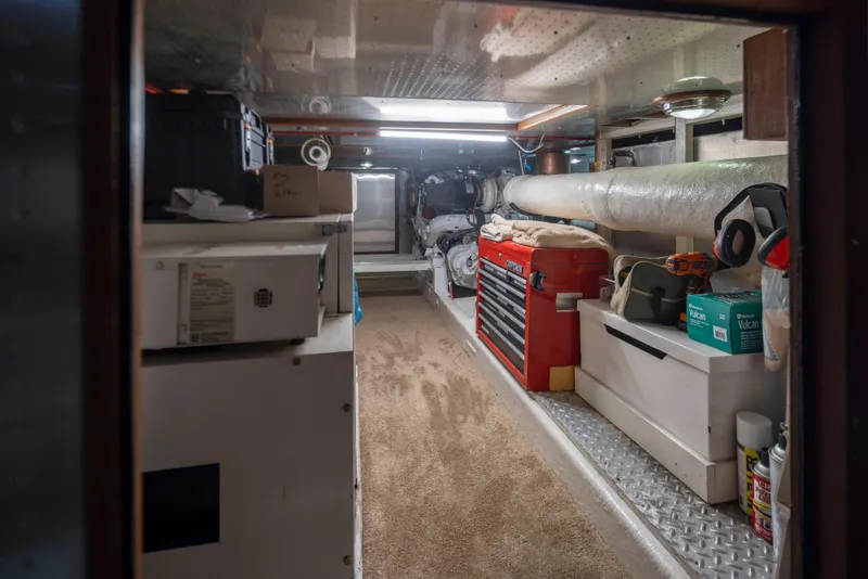 Slide: The Image of Engine room of 1989 Ocean Alexander 50 Sedan with tools and equipment. - 41