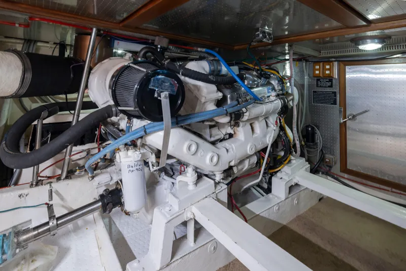 Slide: The Image of Engine room of 1989 Ocean Alexander 50 Sedan yacht, showcasing detailed mechanical components. - 45