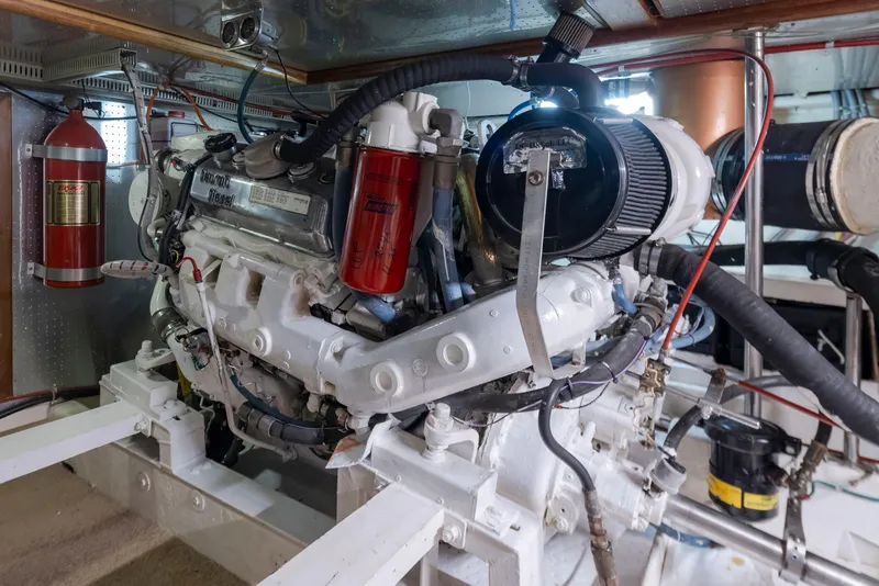 Slide: The Image of Engine room of 1989 Ocean Alexander 50 Sedan yacht, showcasing detailed machinery and components. - 46