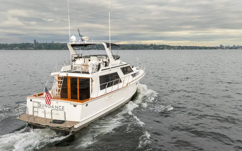 Slide: The Image of 1989 Ocean Alexander 50 Sedan yacht cruising on a cloudy day. - 8