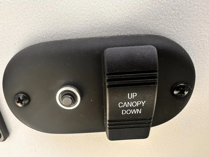 Slide: The Image of Switch for canopy control on 2025 Godfrey SWEETWATER 2286 SB iMPACT Package boat. - 12