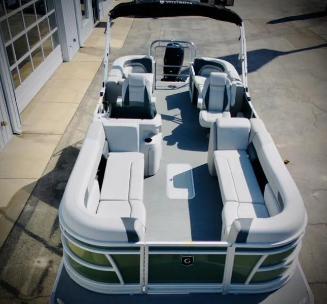 Slide: The Image of 2025 Godfrey SWEETWATER 2286 SB pontoon boat with spacious seating and modern design. - 2