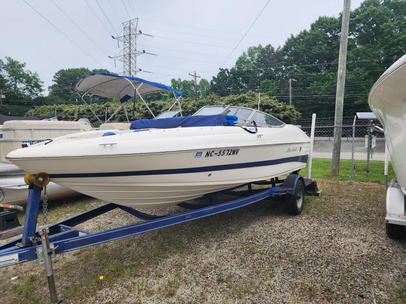 Slide: The Image of 2003 Mariah Bow Rider SX9 boat on trailer, parked outdoors. - 0