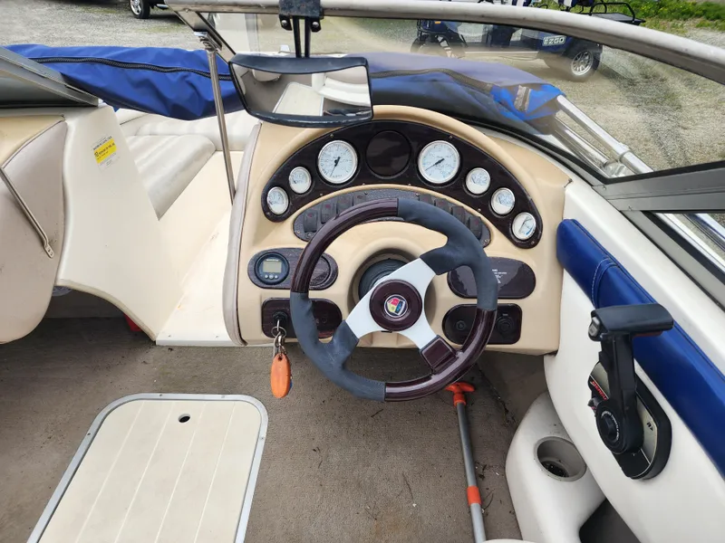 Slide: The Image of 2003 Mariah Bow Rider SX9 dashboard with steering wheel and instrument panel. - 10