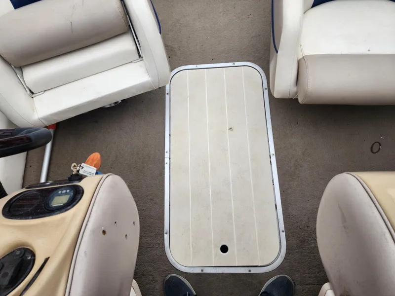Slide: The Image of Interior of a 2003 Mariah Bow Rider SX9 boat showing seating and deck details. - 11