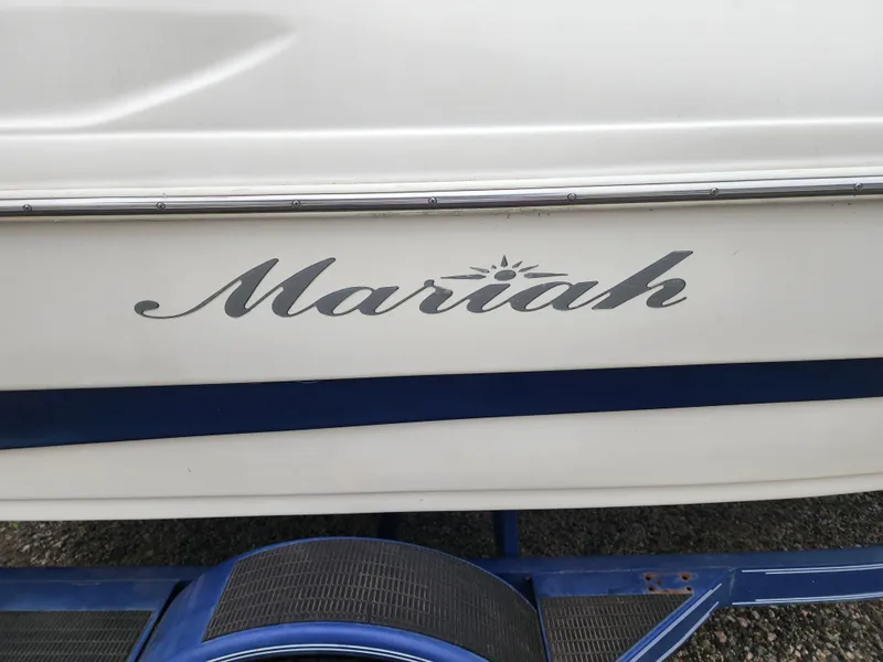Slide: The Image of 2003 Mariah Bow Rider SX9 boat with logo on side. - 13