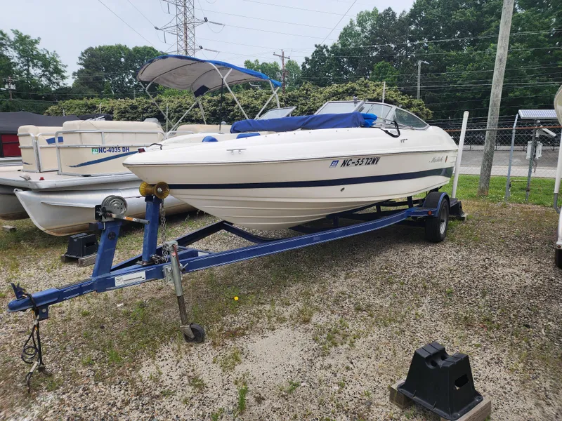 Slide: The Image of 2003 Mariah Bow Rider SX9 boat on trailer, parked outdoors. - 4