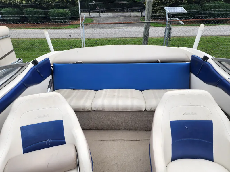 Slide: The Image of 2003 Mariah Bow Rider SX9 interior with blue and white seating. - 8