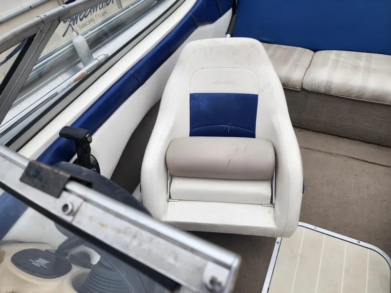 Slide: The Image of 2003 Mariah Bow Rider SX9 boat interior with white and blue seating. - 9