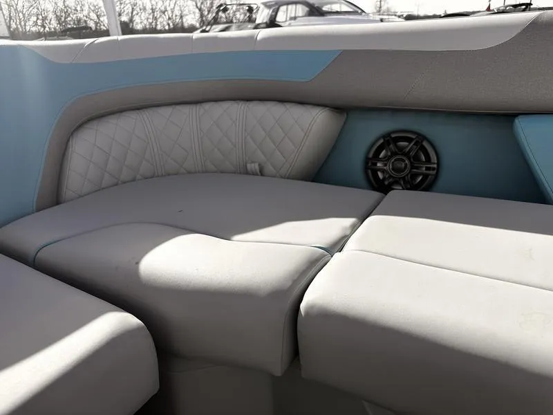 Slide: The Image of Interior seating of 2025 Godfrey Sweetwater 2286 SB boat with speaker and quilted upholstery. - 9