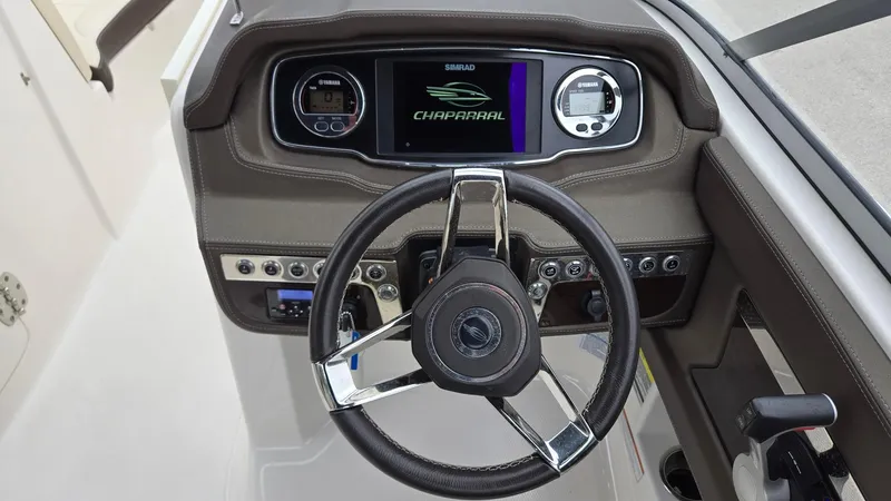 Slide: The Image of Dashboard of 2021 Chaparral 230 boat with steering wheel and control panel. - 14