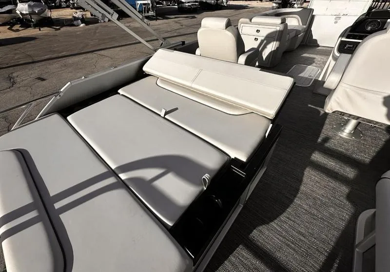 Slide: The Image of 2025 Godfrey Sweetwater 2286 SFLC boat interior with cushioned seating and modern design. - 10