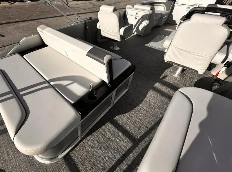 Slide: The Image of Interior of 2025 Godfrey Sweetwater 2286 SFLC pontoon boat with plush seating and modern design. - 11