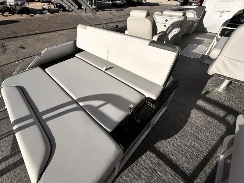 Slide: The Image of 2025 Godfrey Sweetwater 2286 SFLC boat interior with comfortable seating and modern design. - 12