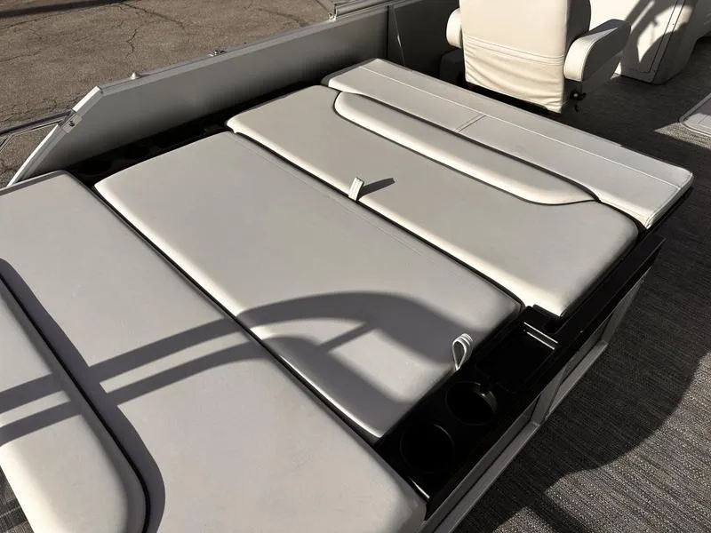 Slide: The Image of 2025 Godfrey Sweetwater 2286 SFLC boat interior with cushioned seating and cup holders. - 13