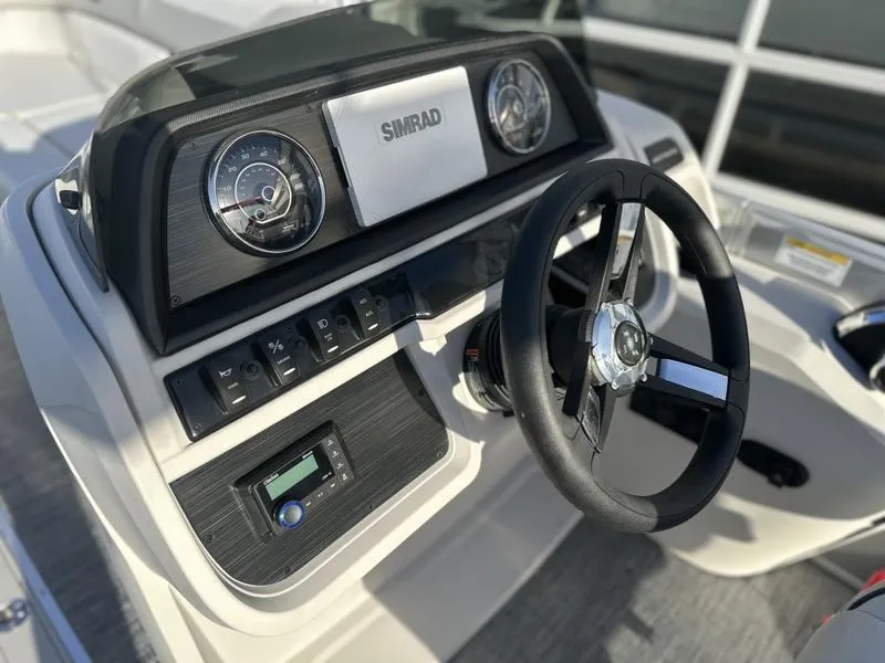 Slide: The Image of Steering console of 2025 Godfrey Sweetwater 2286 SFLC boat with Simrad display. - 4