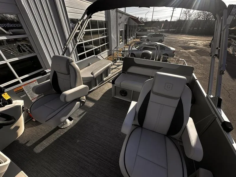Slide: The Image of 2025 Godfrey Sweetwater 2286 SFLC boat interior with plush seating and modern design. - 9