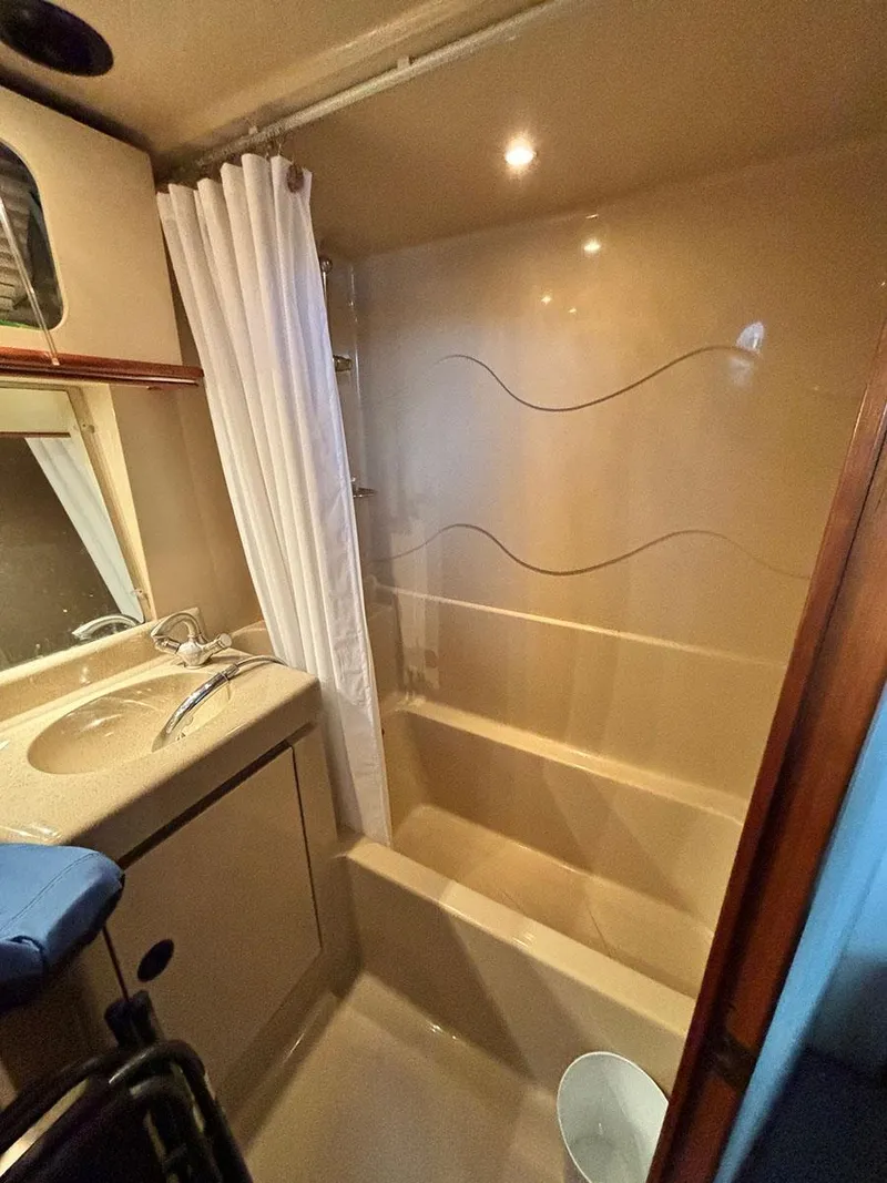 Slide: The Image of Bathroom interior of 2004 Cruisers Yachts 375 Motoryacht with shower and sink. - 15