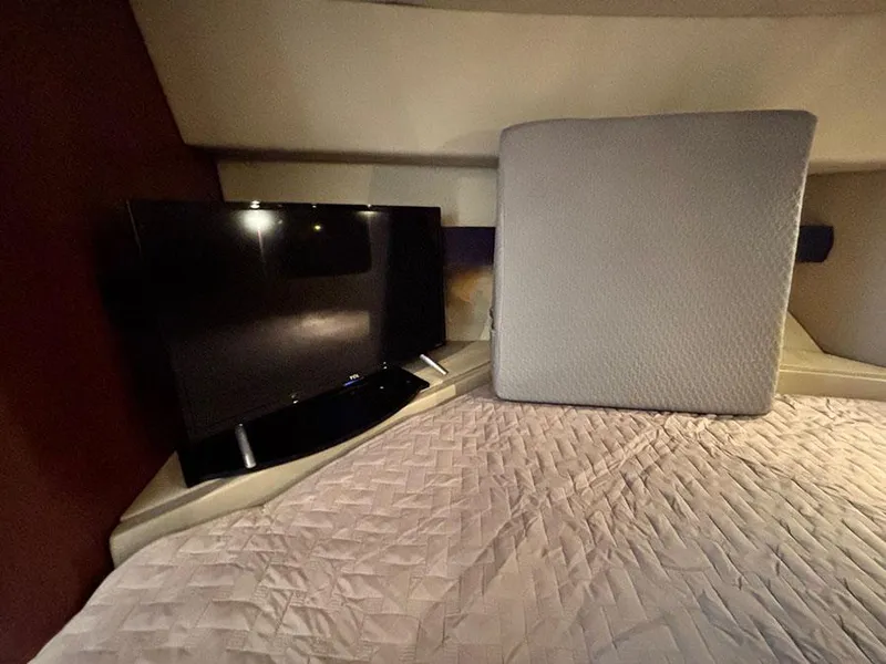 Slide: The Image of 2004 Cruisers Yachts 375 Motoryacht interior with TV and bed. - 33