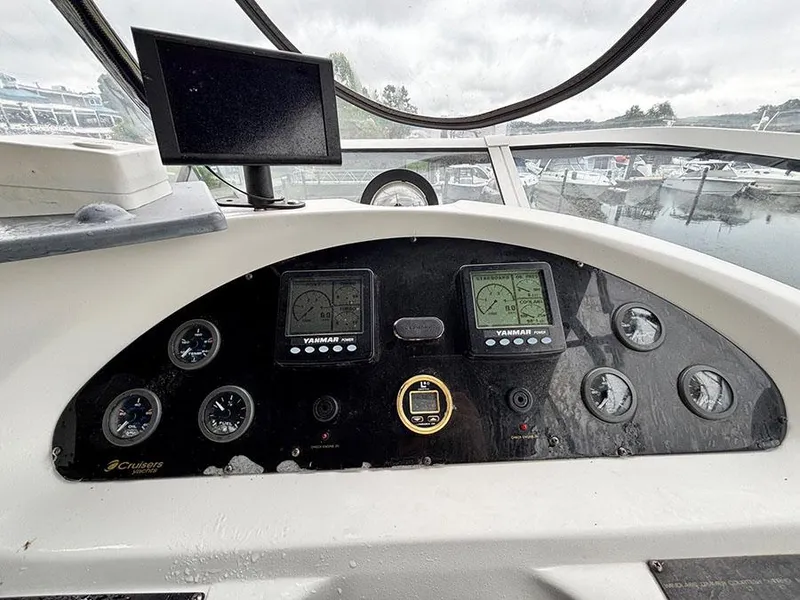 Slide: The Image of Control panel of 2004 Cruisers Yachts 375 Motoryacht with gauges and displays. - 38