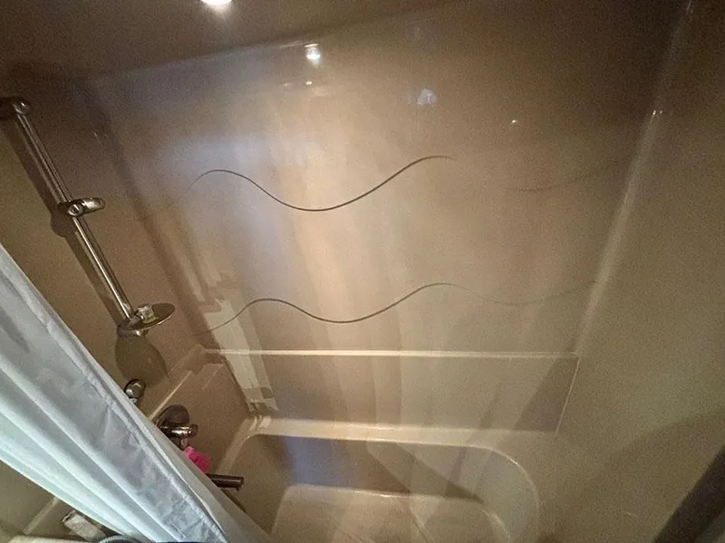 Slide: The Image of Shower area in 2004 Cruisers Yachts 375 Motoryacht with modern fixtures and curtain. - 14