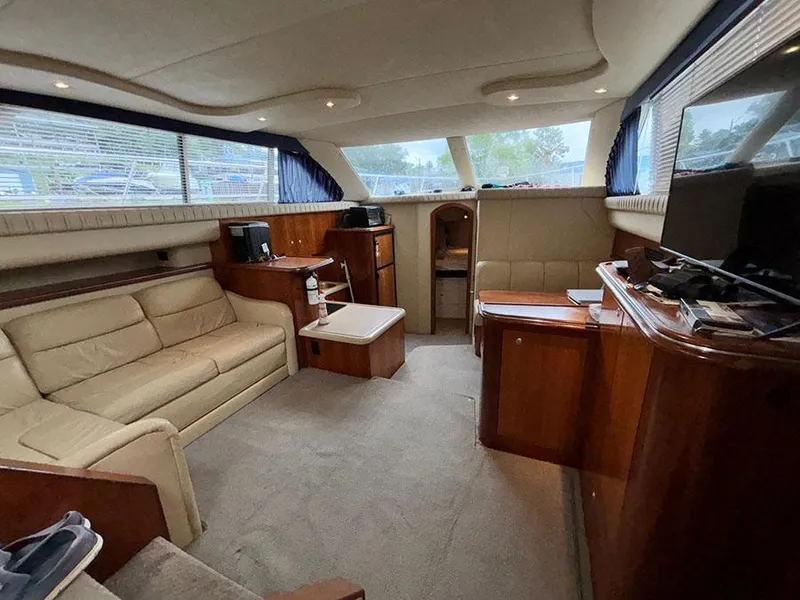 Slide: The Image of Luxurious interior of 2004 Cruisers Yachts 375 Motoryacht with plush seating and wood finishes. - 21