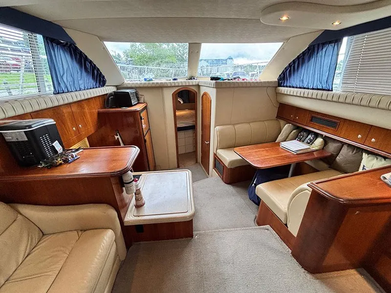 Slide: The Image of 2004 Cruisers Yachts 375 Motoryacht interior with cozy seating and elegant wood finishes. - 23