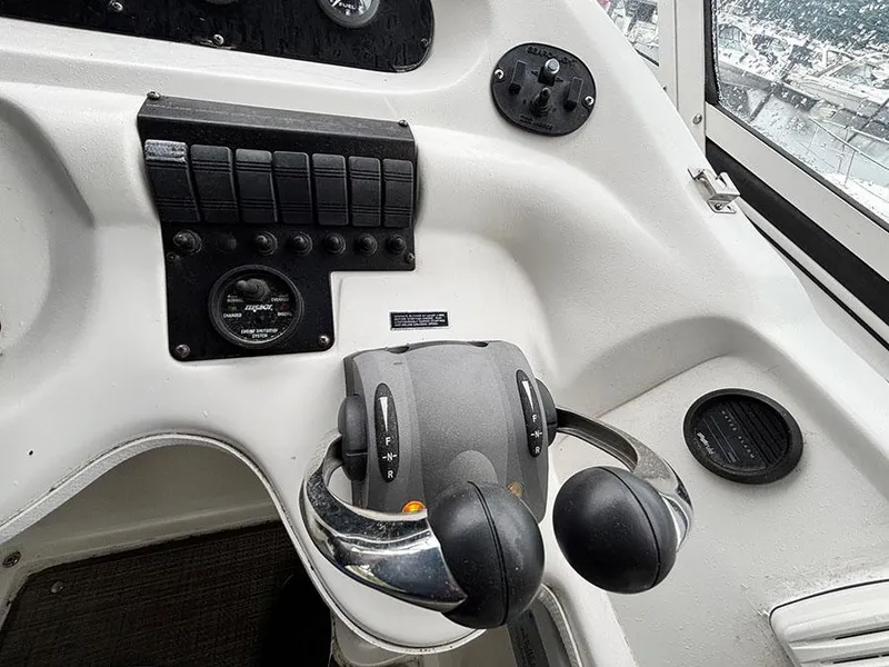 Slide: The Image of Control panel of 2004 Cruisers Yachts 375 Motoryacht with throttle and switches. - 39