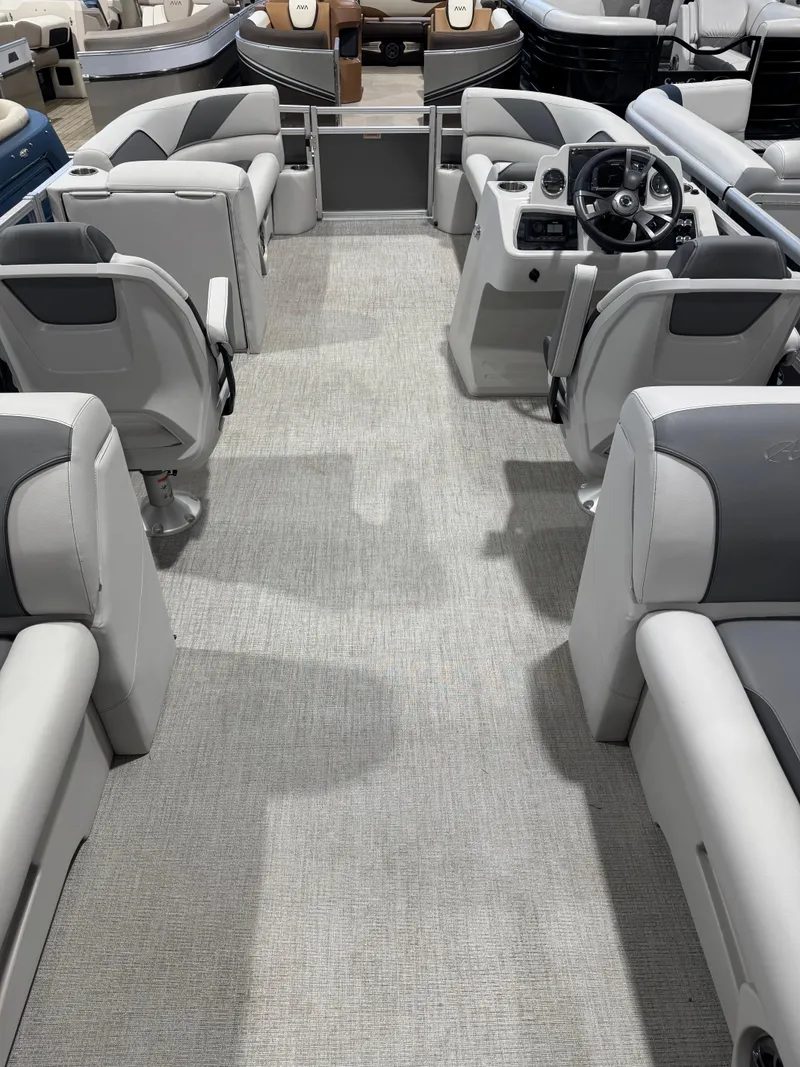 Slide: The Image of 2024 Avalon 2385 25 Venture 85 QL pontoon boat interior with modern seating and steering console. - 12