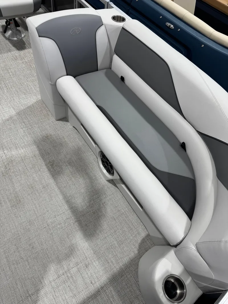 Slide: The Image of 2024 Avalon 2385 25 Venture 85 QL boat interior with sleek, modern seating design. - 3