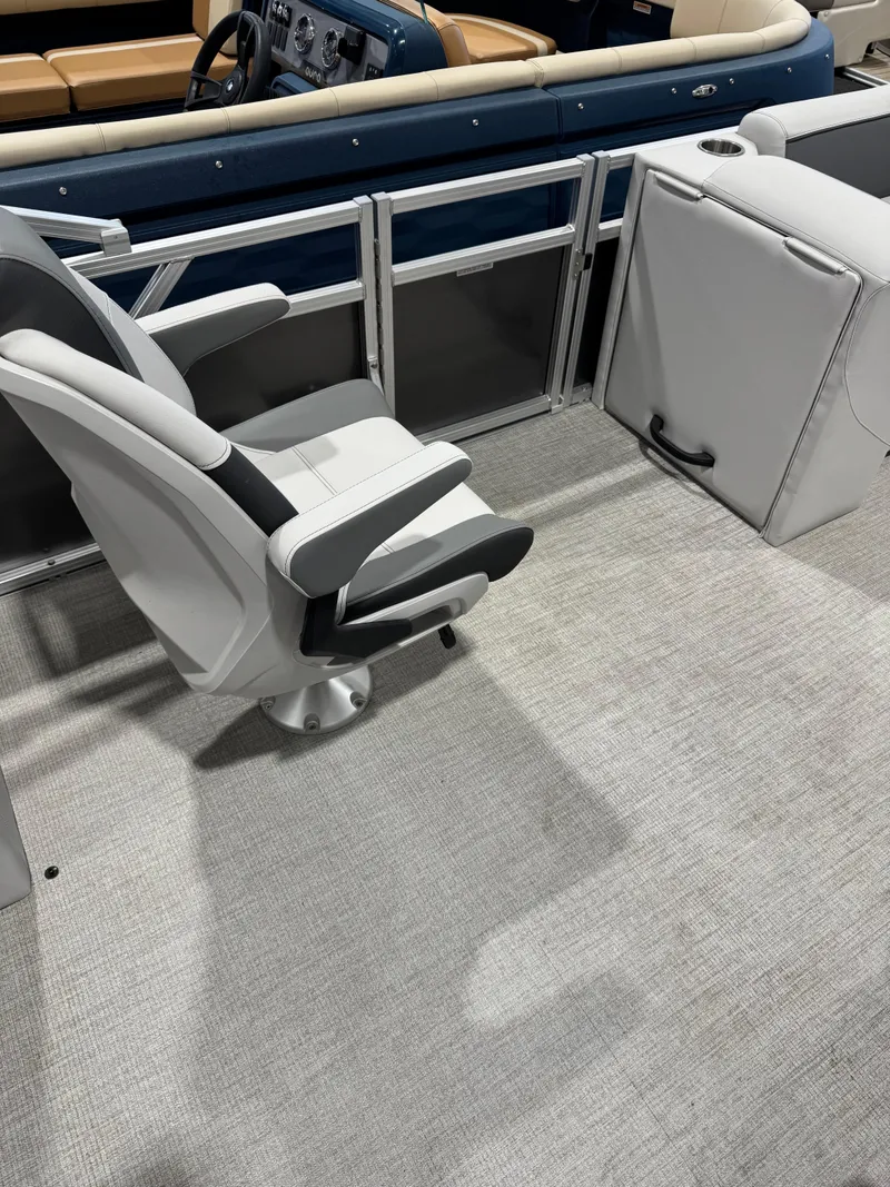 Slide: The Image of 2024 Avalon 2385 25 Venture 85 QL boat interior with seating and console. - 7