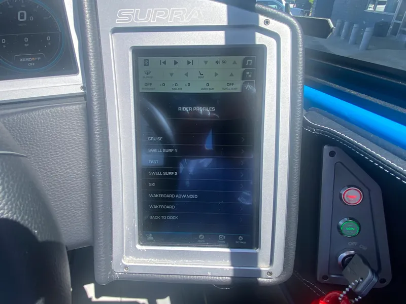 Slide: The Image of 2021 Supra SL 450 dashboard touchscreen displaying rider profiles and controls. - 19