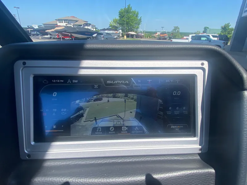 Slide: The Image of Dashboard display of a 2021 Supra SL 450 boat with rearview camera. - 21