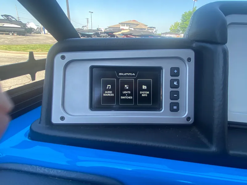 Slide: The Image of 2021 Supra SL 450 dashboard display with audio, lights, and system info controls. - 22