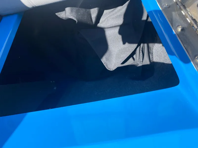 Slide: The Image of 2021 Supra SL 450 interior detail with blue and black accents. - 25