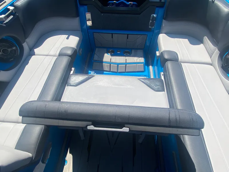 Slide: The Image of Interior of 2021 Supra SL 450 boat with gray and blue seating. - 35