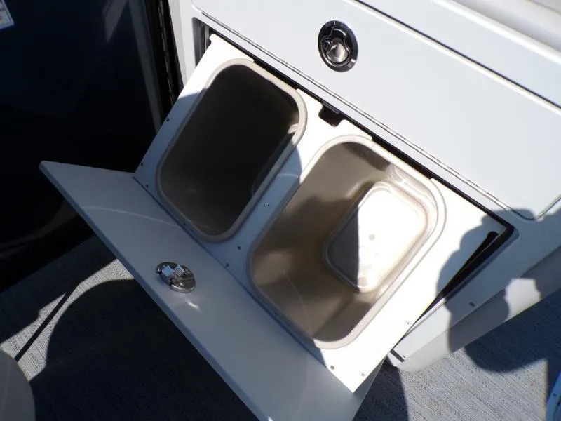 Slide: The Image of Open storage compartment on 2025 Godfrey Sweetwater 2486 QS iMPACT boat. - 16