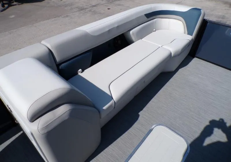 Slide: The Image of 2025 Godfrey Sweetwater 2486 QS iMPACT pontoon boat seating, featuring plush, light gray upholstery. - 20