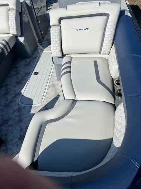Slide: The Image of 2023 Crest Continental 250 boat interior with luxurious seating and modern design. - 17