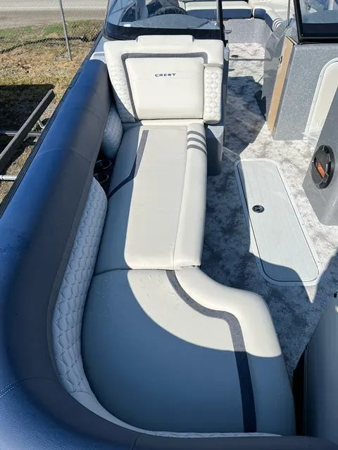 Slide: The Image of 2023 Crest Continental 250 boat interior with sleek seating and modern design. - 18