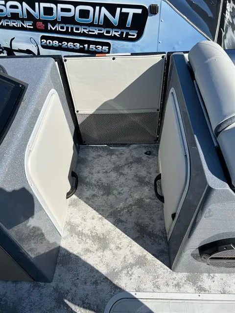 Slide: The Image of 2023 Crest Continental 250 boat interior with seating and storage compartments. - 20