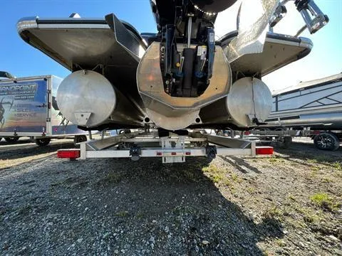 Slide: The Image of 2023 Crest Continental 250 pontoon boat on trailer, rear view, sunny day. - 27