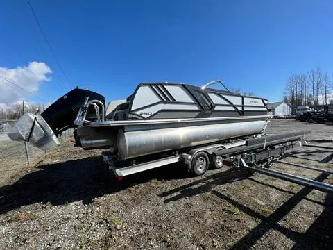 Slide: The Image of 2023 Crest Continental 250 pontoon boat on trailer under clear blue sky. - 3