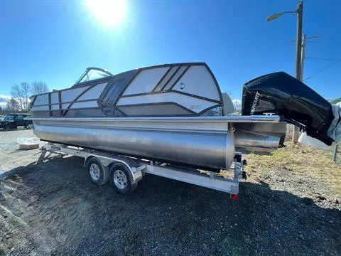 Slide: The Image of 2023 Crest Continental 250 pontoon boat on trailer under clear blue sky. - 4