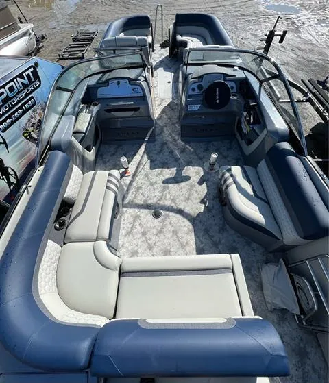 Slide: The Image of 2023 Crest Continental 250 pontoon boat interior with spacious seating and modern design. - 6