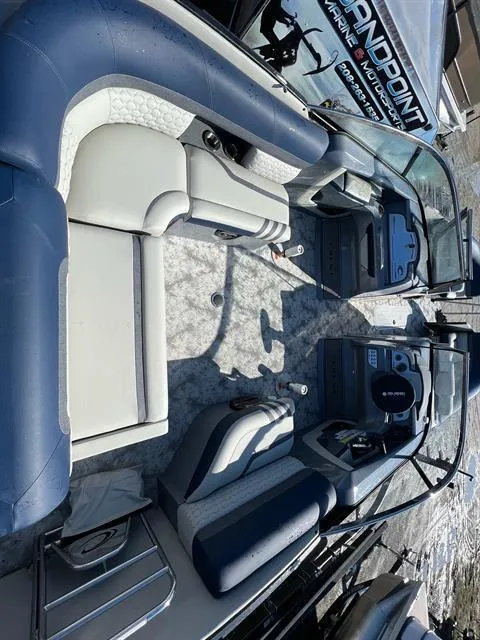 Slide: The Image of 2023 Crest Continental 250 boat interior with luxurious seating and modern design. - 7