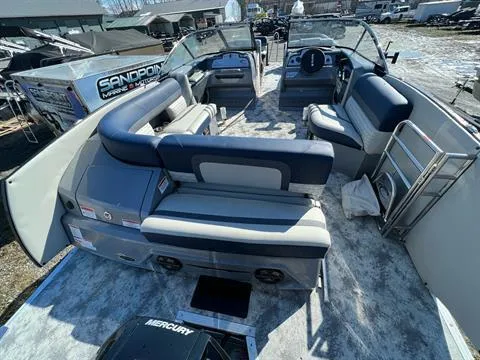 Slide: The Image of 2023 Crest Continental 250 pontoon boat interior with spacious seating and modern design. - 9