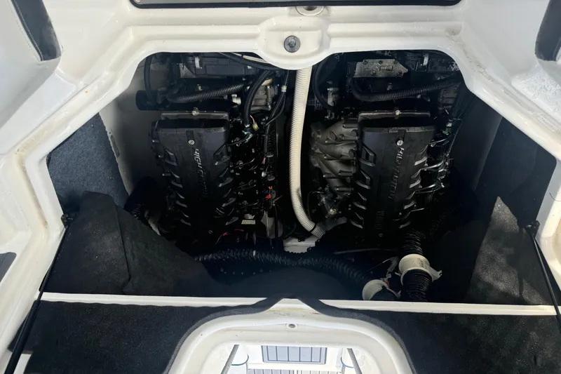 Slide: The Image of 2018 Yamaha Boats 242 Limited S E-Series engine compartment with dual high-output engines. - 13